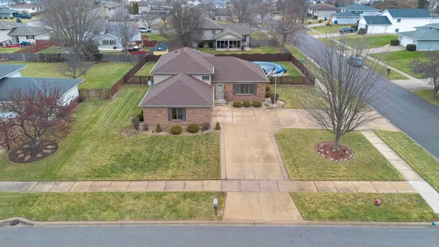 a view of multiple houses with a yard