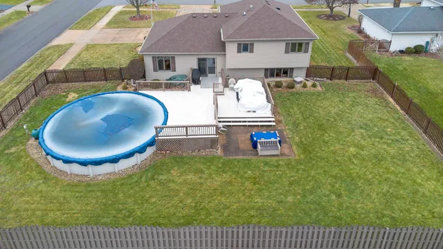 swimming pool view with a seating space