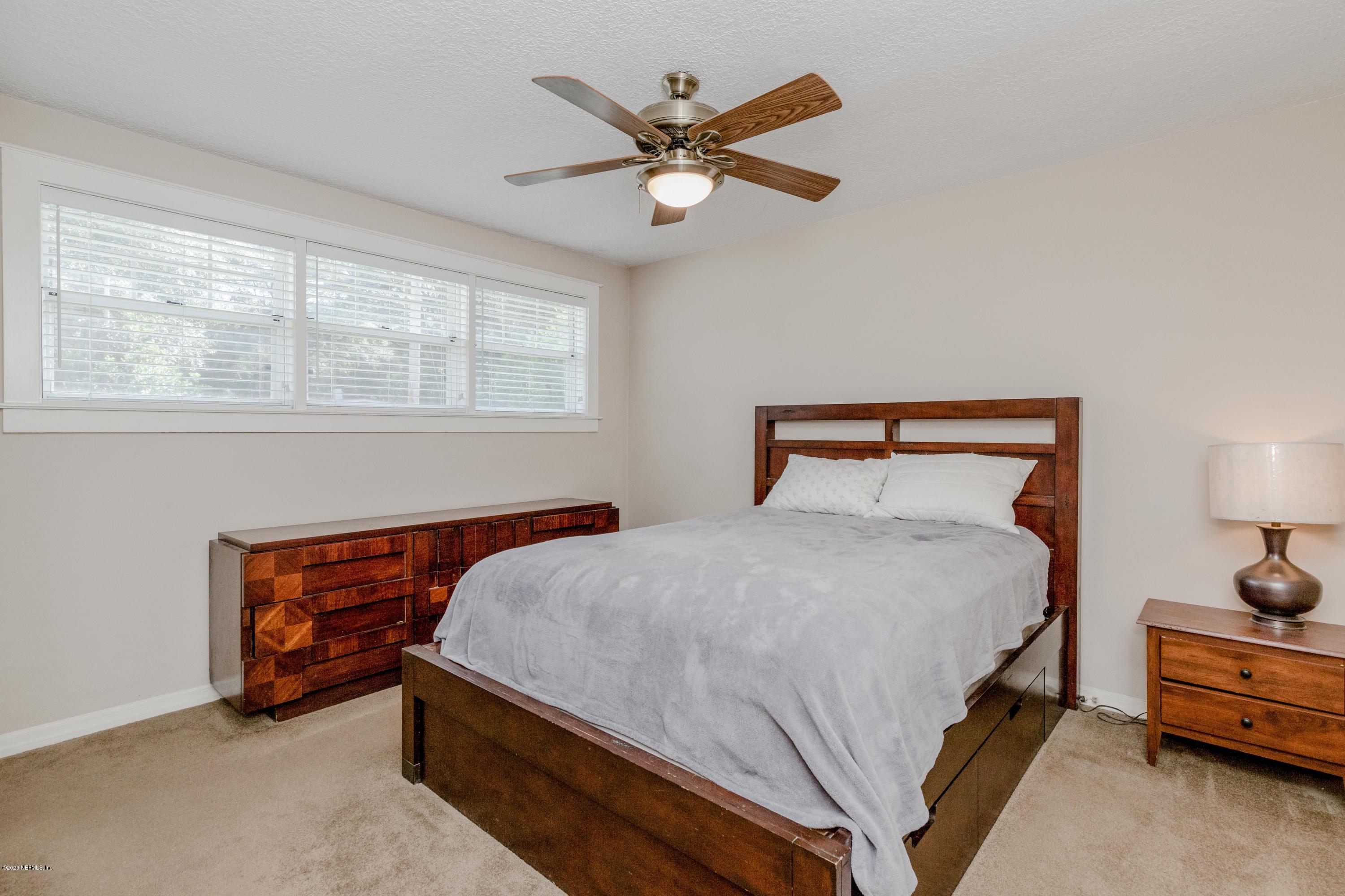 3118 Kline Road Jacksonville, FL 32246 - Photo 18 of 39 a bedroom with bed and window
