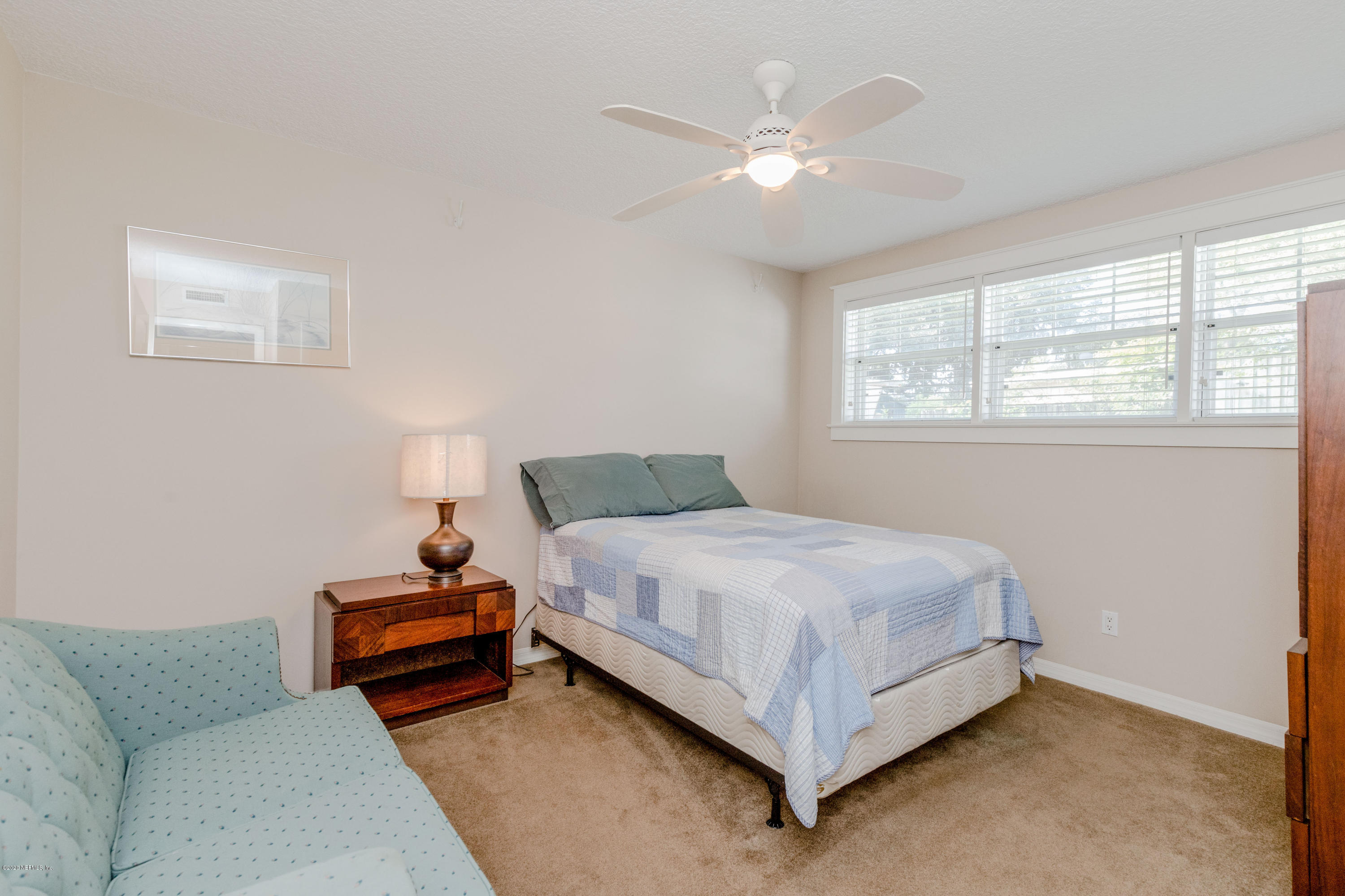 3118 Kline Road Jacksonville, FL 32246 - Photo 23 of 39 a bed room with a bed and a couch