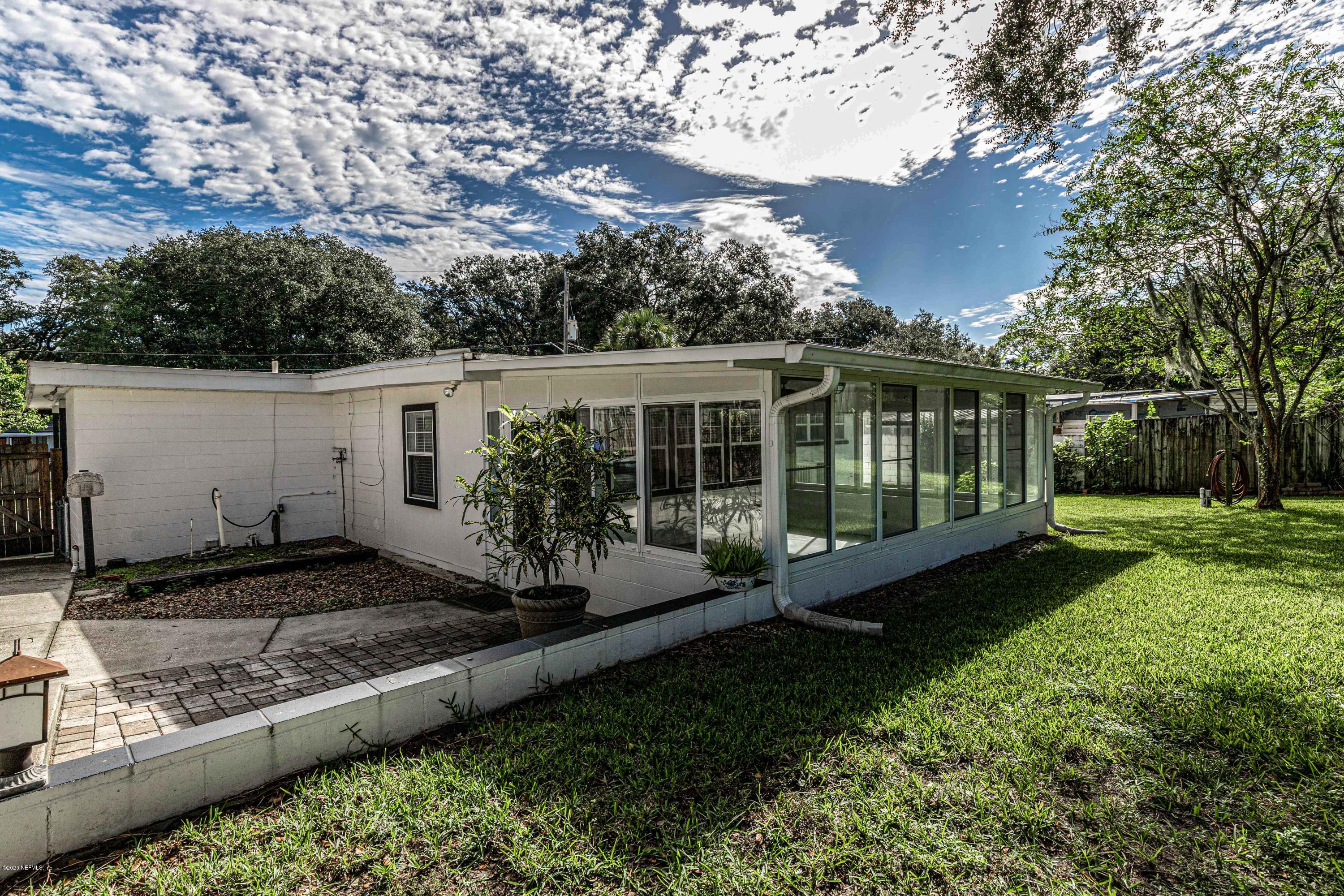 3118 Kline Road Jacksonville, FL 32246 - Photo 35 of 39 a view of a house with backyard sitting area and garden