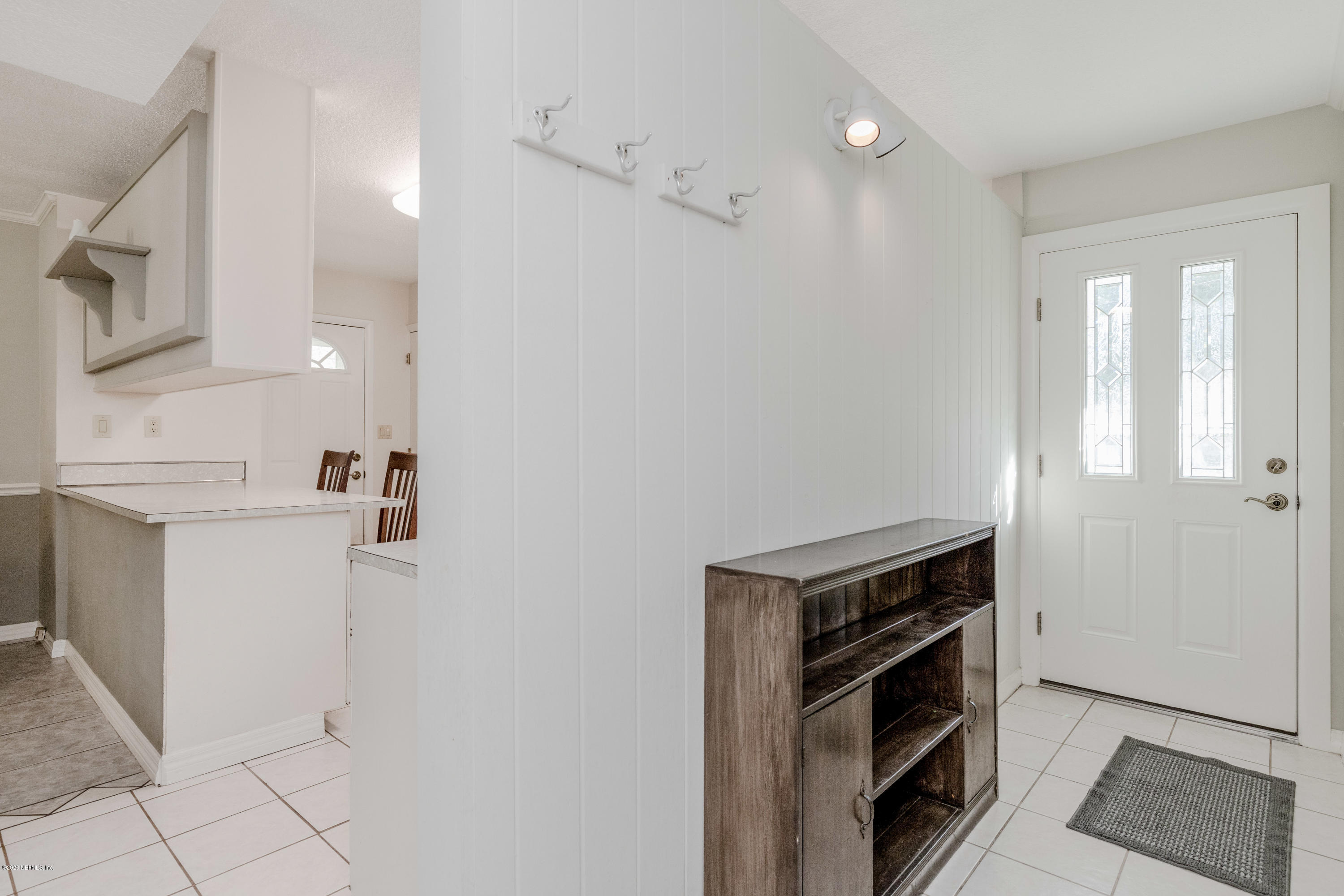 3118 Kline Road Jacksonville, FL 32246 - Photo 6 of 39 a view of kitchen with white cabinets and white appliances