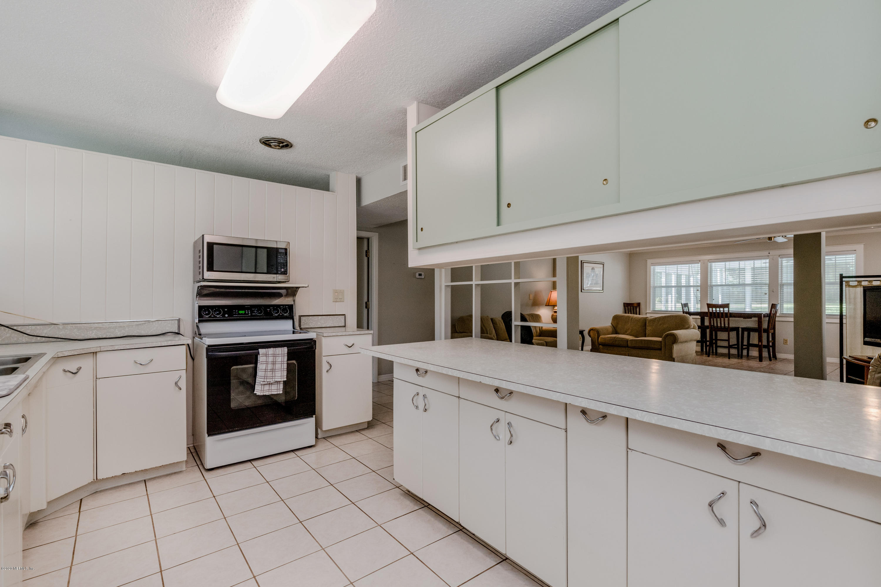 3118 Kline Road Jacksonville, FL 32246 - Photo 9 of 39 a kitchen with cabinets and appliances