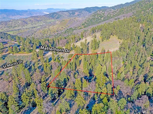 a view of a city with mountains in the background