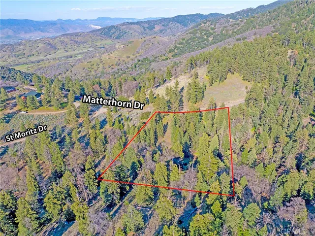 a view of a city with mountains in the background