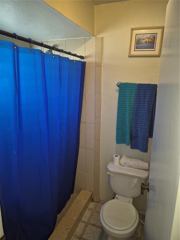 13710 Whitby Road Hudson, FL 34667 - Photo 9 of 21 a bathroom with a toilet and a shower