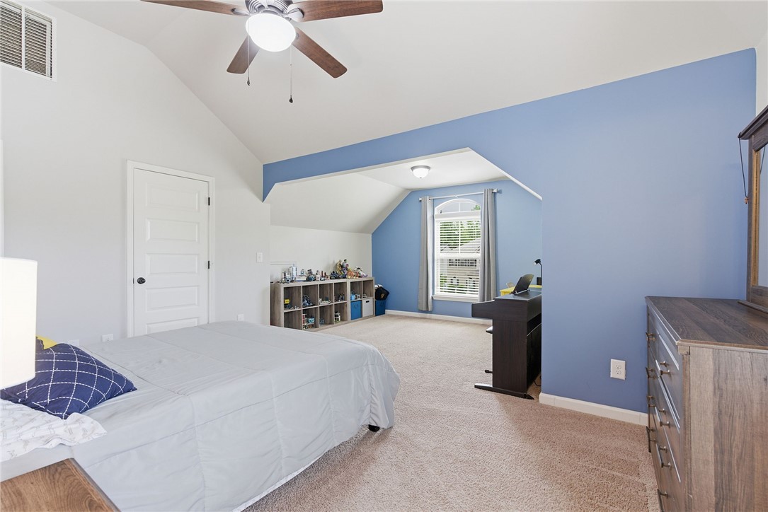 138 Buckland Drive Anderson, SC 29621 - Photo 36 of 49 This spacious bedroom features a vaulted ceiling and ample natural light, perfect for comfortable living.