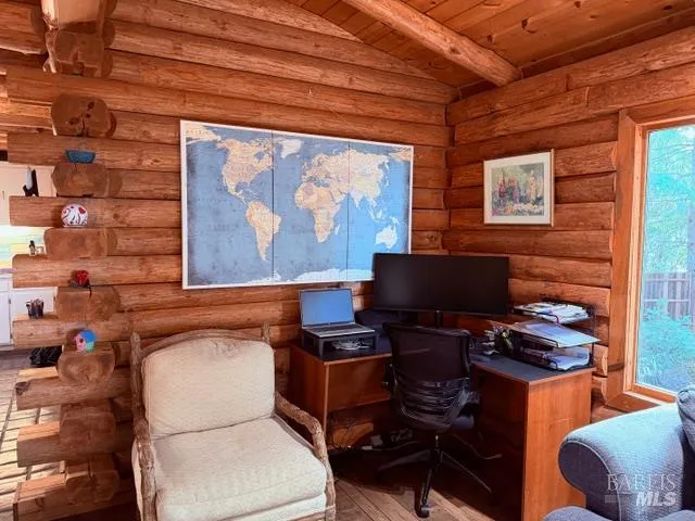 a living room with a fireplace and a glass door shower