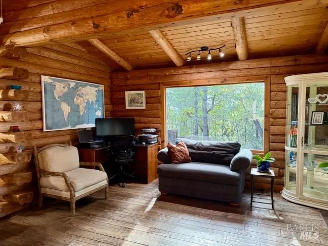 a bathroom with a toilet and shower curtain