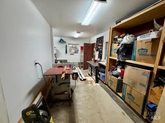 a view of a patio with couches chairs and a potted plant