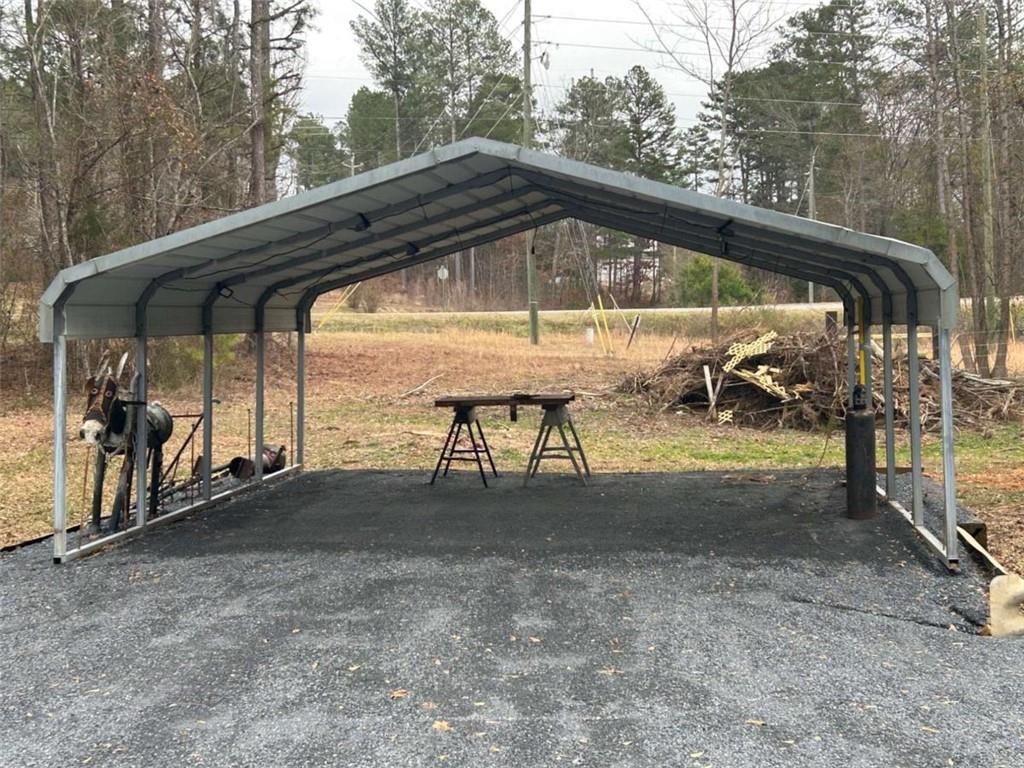 1544 Dry Creek Road Cedartown, GA 30125 - Photo 11 of 13 a view of backyard with a car parked