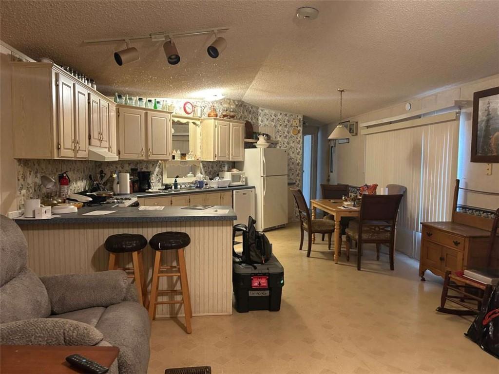 1544 Dry Creek Road Cedartown, GA 30125 - Photo 7 of 13 a kitchen with granite countertop a sink cabinets and appliances
