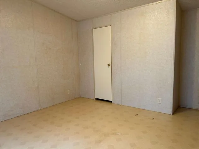a bath tub sitting in a bathroom next to a window