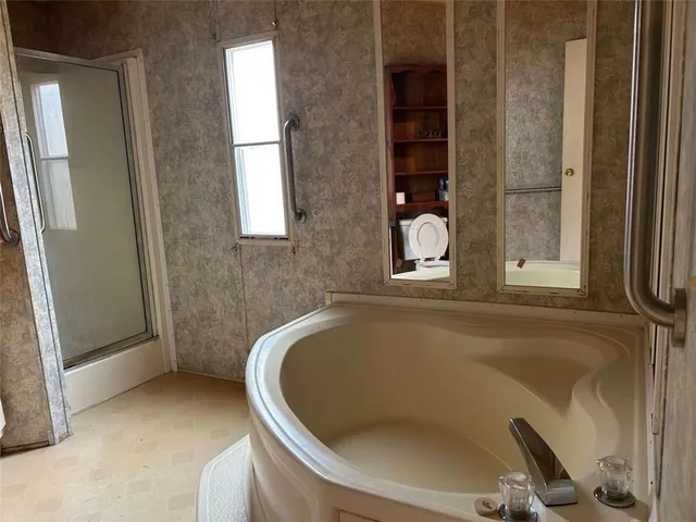 a view of backyard with a car parked