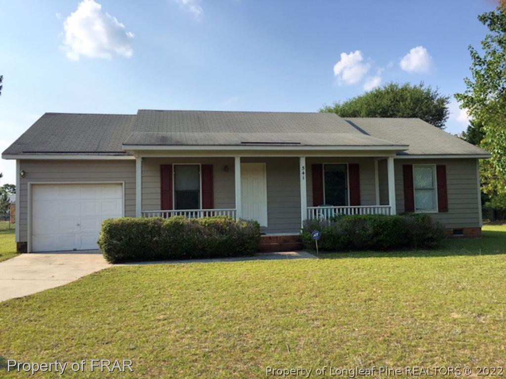 541 Camden Road Raeford, NC 28376 - Photo 1 of 24 a front view of a house having yard