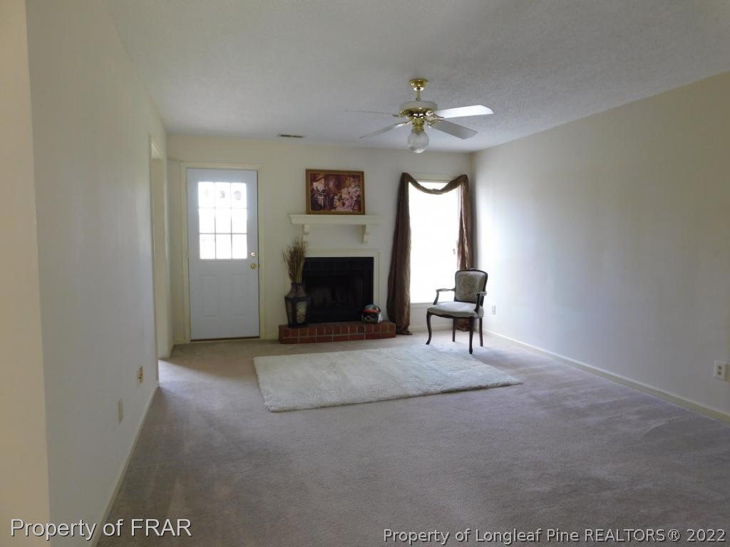 541 Camden Road Raeford, NC 28376 - Photo 8 of 24 a view of a livingroom with a fireplace and window