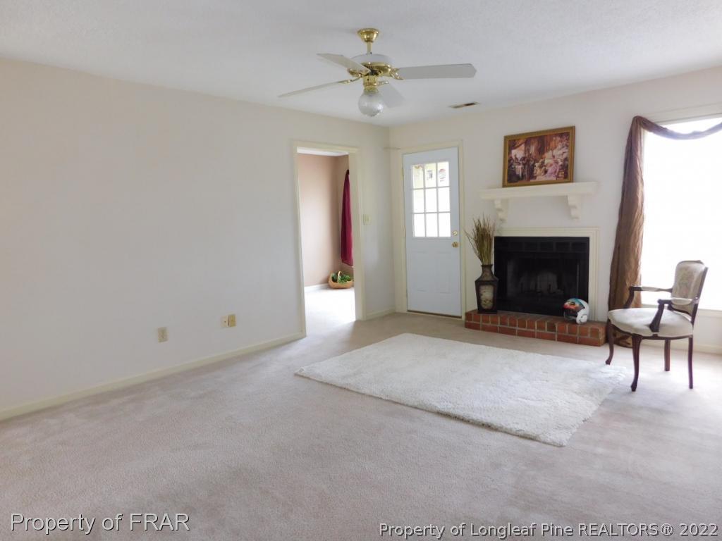541 Camden Road Raeford, NC 28376 - Photo 10 of 24 a living room with furniture and a fireplace