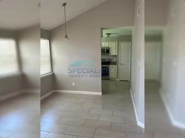 a view of an empty room with a window