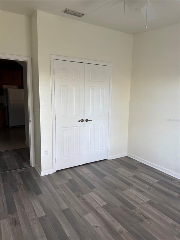 3051 Greystone Loop, Unit 304 Kissimmee, FL 34741 - Photo 18 of 32 wooden floor in an empty room