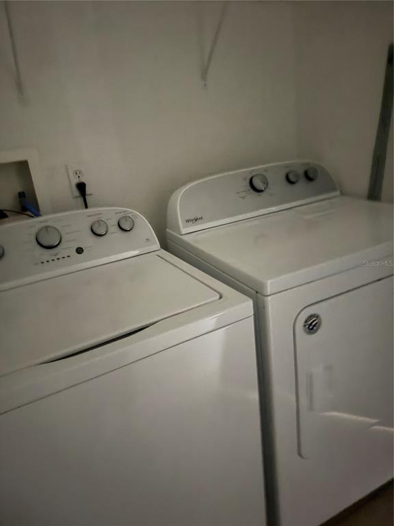 3051 Greystone Loop, Unit 304 Kissimmee, FL 34741 - Photo 26 of 32 a utility room with dryer and washer