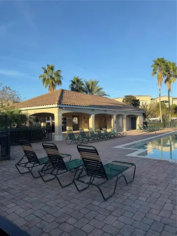 a view of a swimming pool with a patio