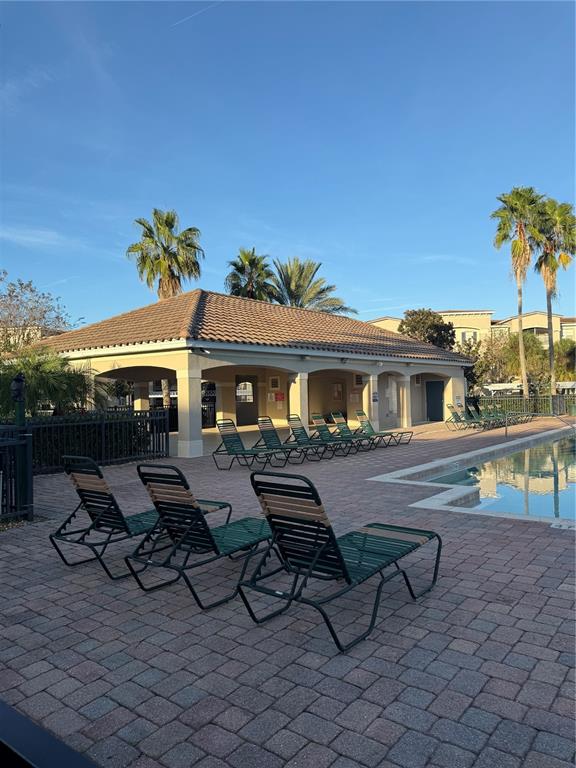 3051 Greystone Loop, Unit 304 Kissimmee, FL 34741 - Photo 27 of 32 a view of house with outdoor seating space
