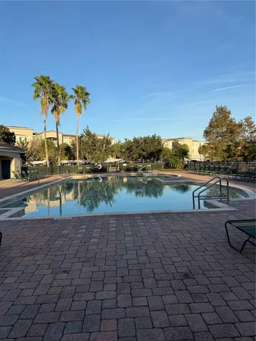 a view of a yard with a house in the background