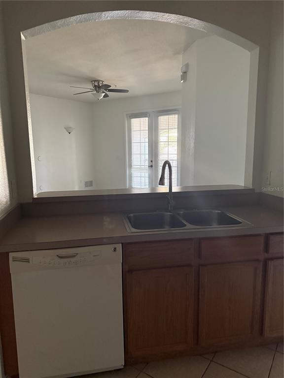 3051 Greystone Loop, Unit 304 Kissimmee, FL 34741 - Photo 5 of 32 a kitchen with a sink and cabinets