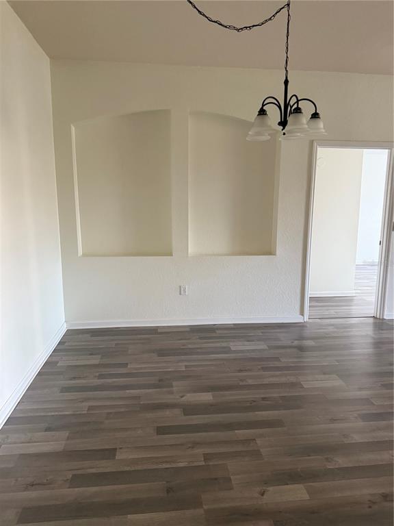 3051 Greystone Loop, Unit 304 Kissimmee, FL 34741 - Photo 9 of 32 a view of a room with wooden floor and cabinet