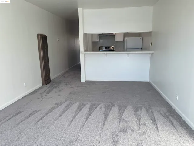 a view of kitchen with cabinets