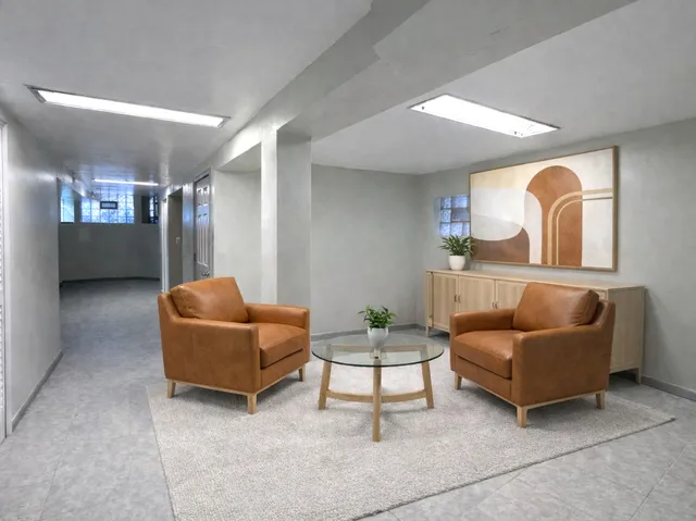 a living room with furniture and a large window