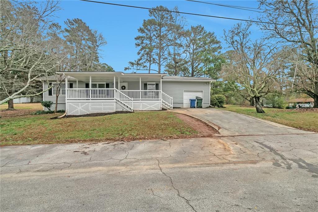 4556 Amy Road Snellville, GA 30039 - Photo 1 of 1 front view of house with a yard
