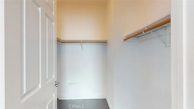 a bathroom with a granite countertop bathtub sink vanity and toilet