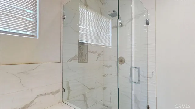 an aerial view of a house with a backyard