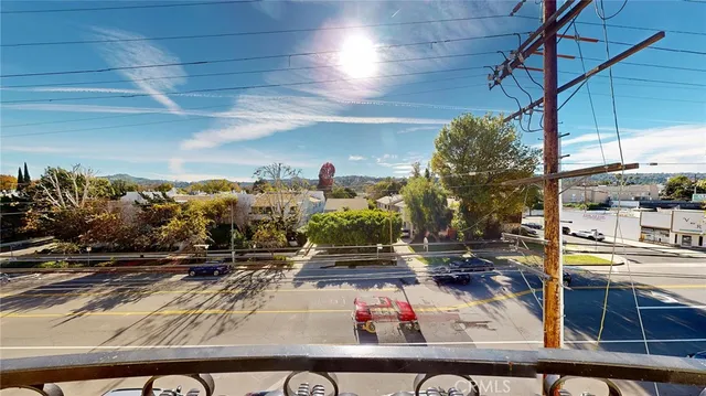 a kitchen with kitchen island a appliances a sink a counter space and cabinets