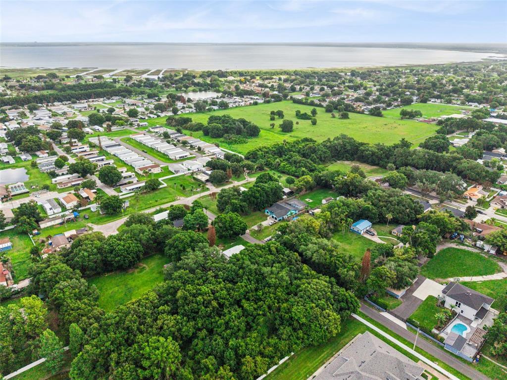 420 Jacks Memorial Road St. Cloud, FL 34769 - Photo 30 of 31 an aerial view of residential houses with outdoor space and trees