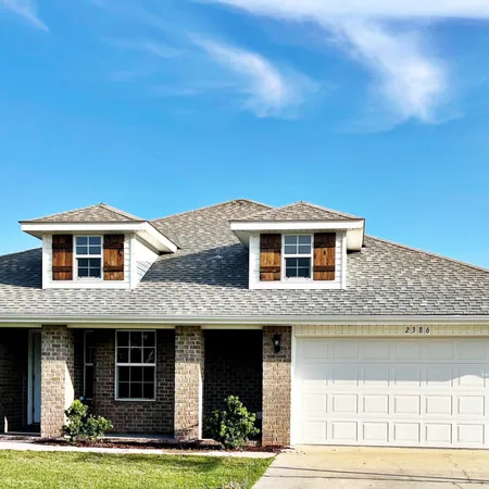 a front view of a house with yard