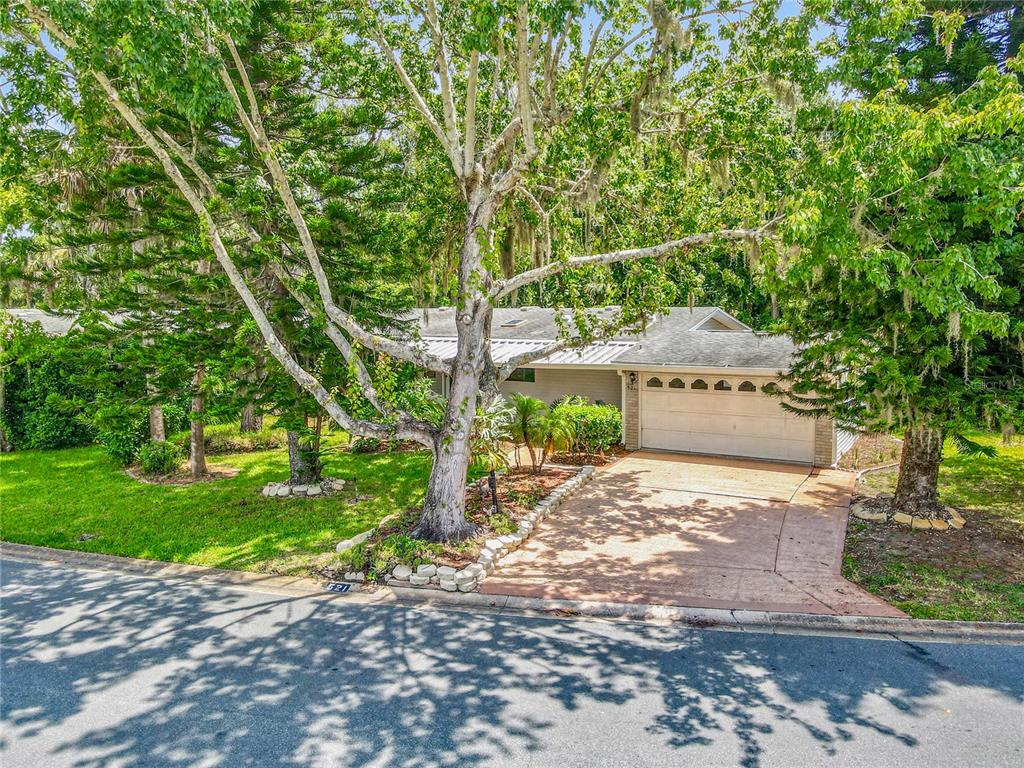 a pathway of a house with a yard