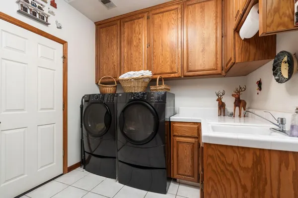 a row of palm trees in front of a building