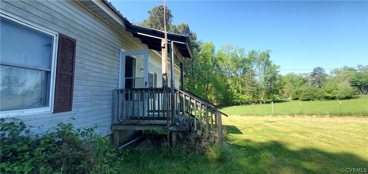 2564 Reedy Branch Road Brodnax, VA 23920 - Photo 6 of 6 a view of a house with a small yard and sitting area