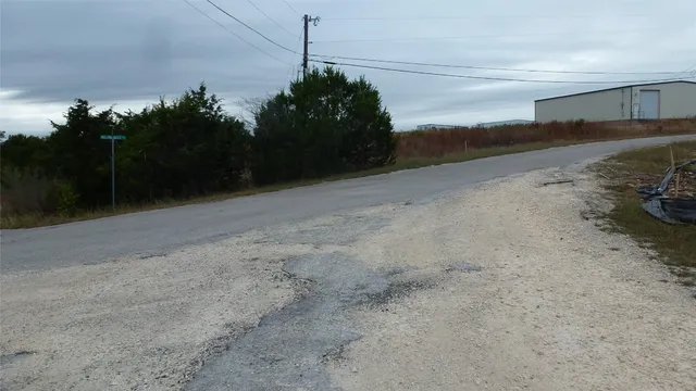 a view of a bench in a backyard