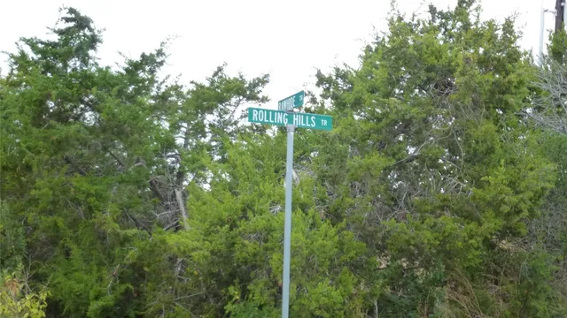 a view of a house with backyard and porch
