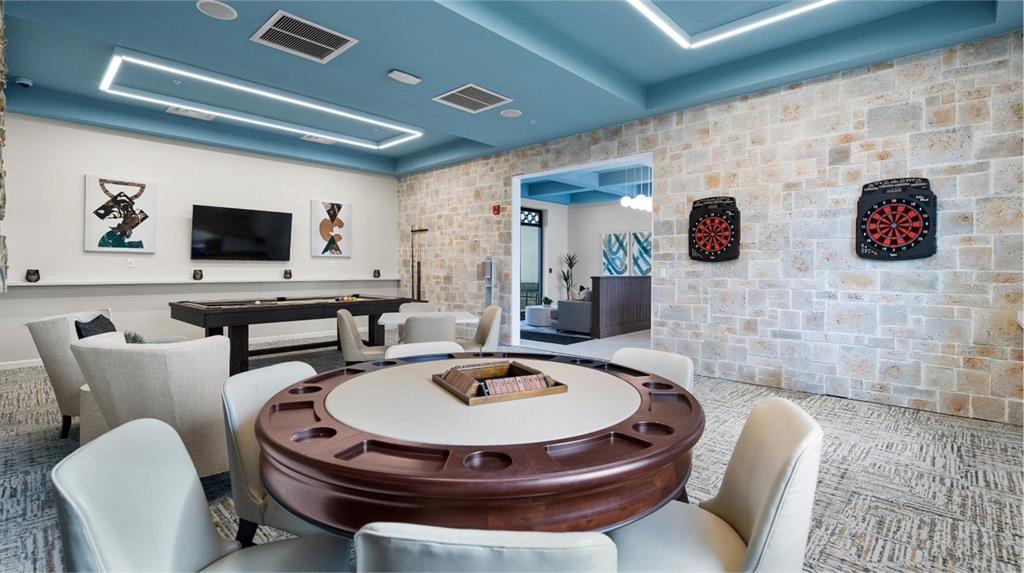 4839 Kings Castle Circle Kissimmee, FL 34746 - Photo 17 of 20 a table and chairs in a room