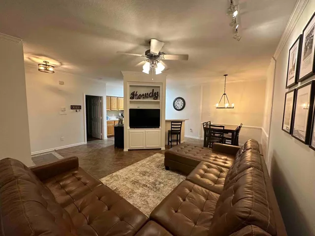 a kitchen with a stove a sink and a refrigerator