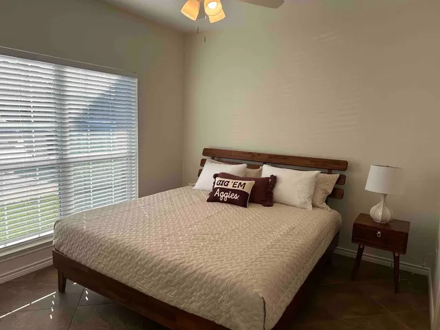 a en suite bathroom with a sink and a mirror