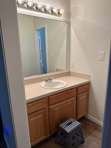 a view of a hallway with a closet and a window