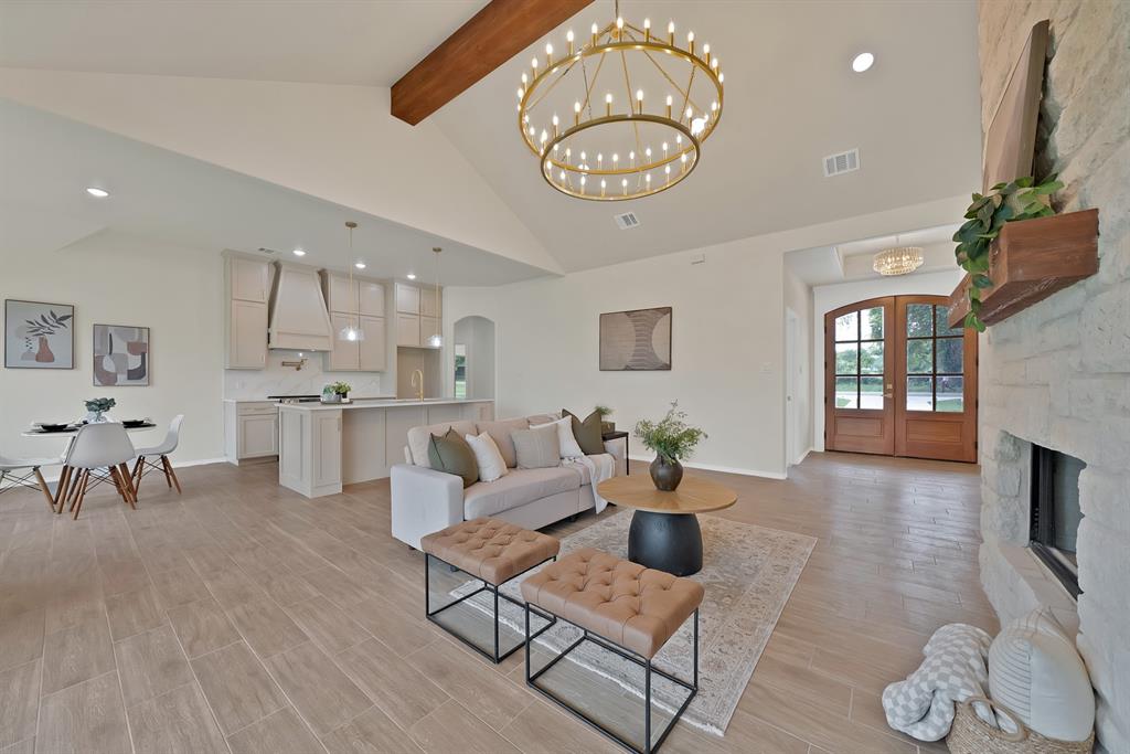 501 Harris Road Azle, TX 76020 - Photo 3 of 29 a living room with furniture kitchen view and a chandelier