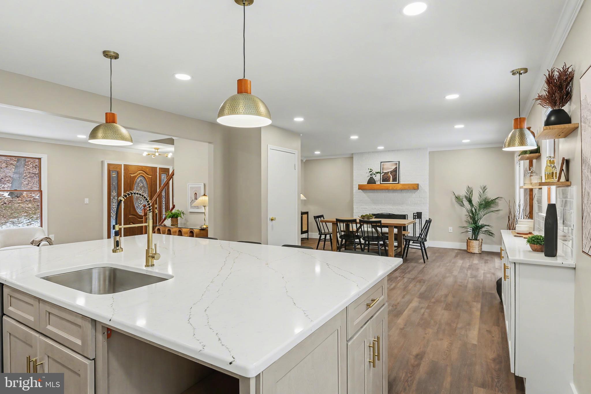 175 Timber Lane Lebanon, PA 17042 - Photo 11 of 39 a kitchen with stainless steel appliances a sink a center island a stove a counter space a sink and living room view