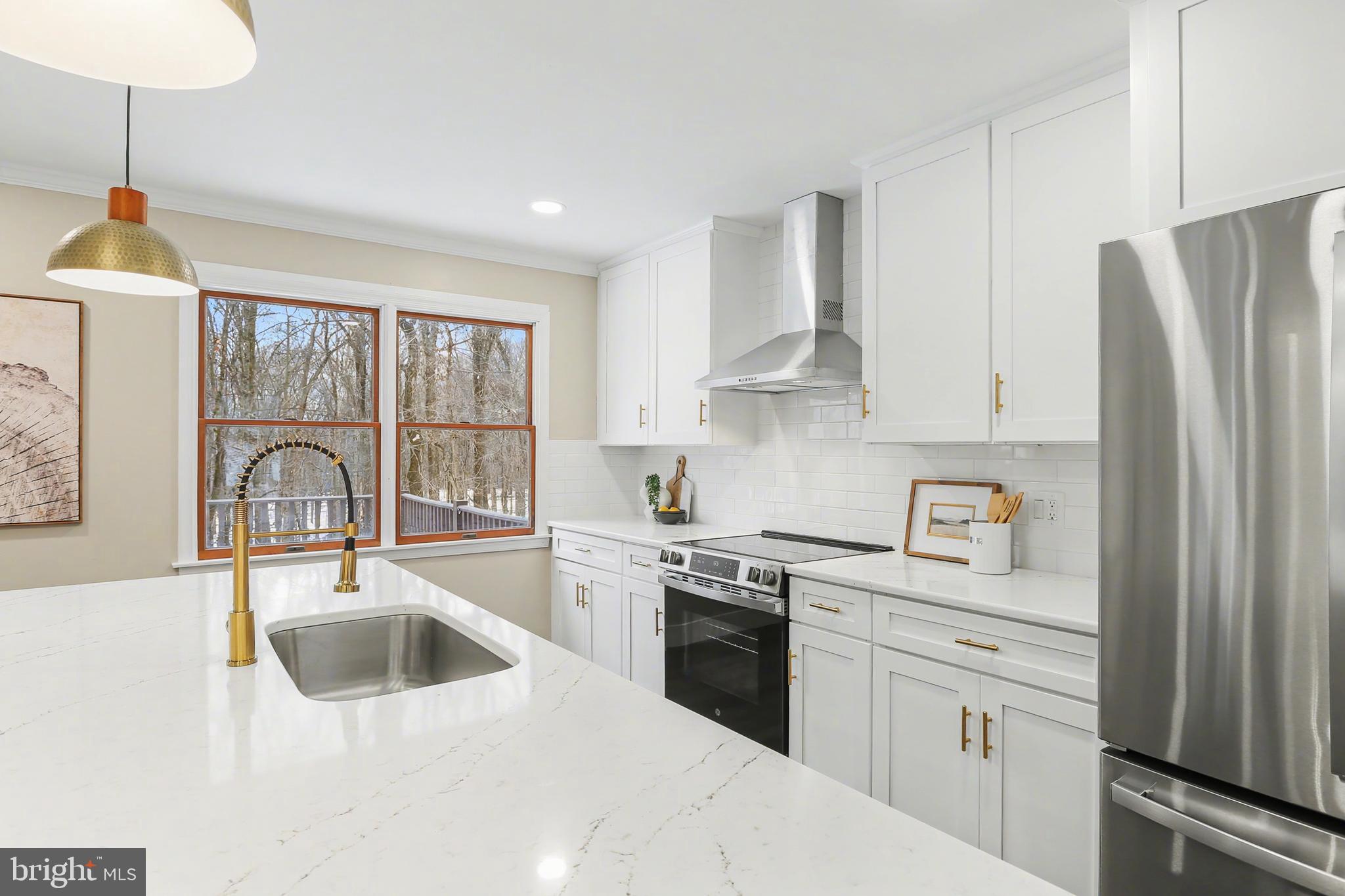 175 Timber Lane Lebanon, PA 17042 - Photo 12 of 39 a kitchen with granite countertop a sink stainless steel appliances and white cabinets