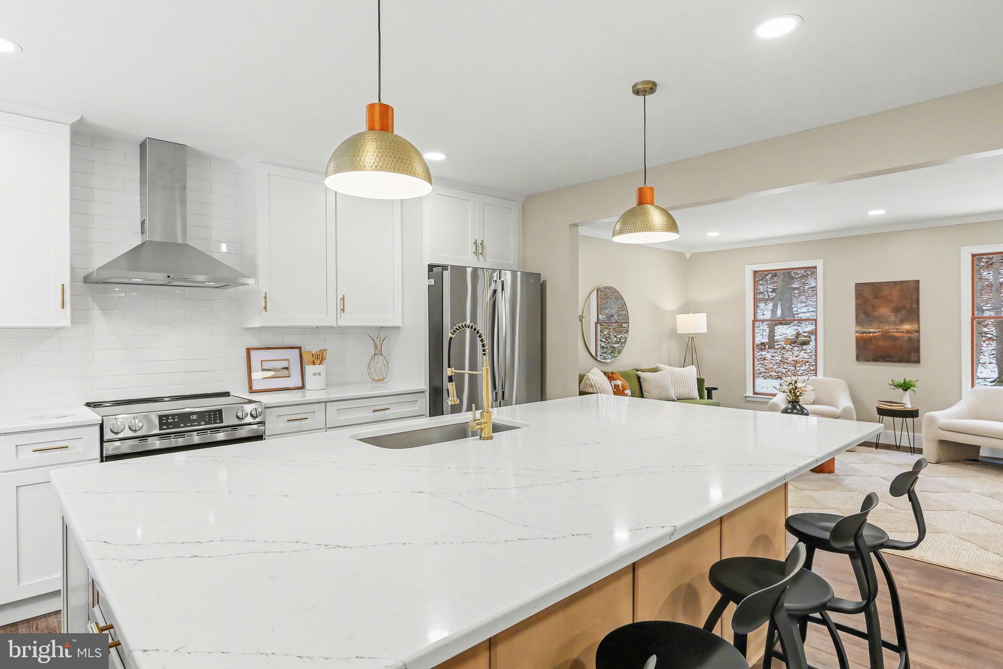 175 Timber Lane Lebanon, PA 17042 - Photo 10 of 39 a kitchen with stainless steel appliances a stove a sink a refrigerator and chairs